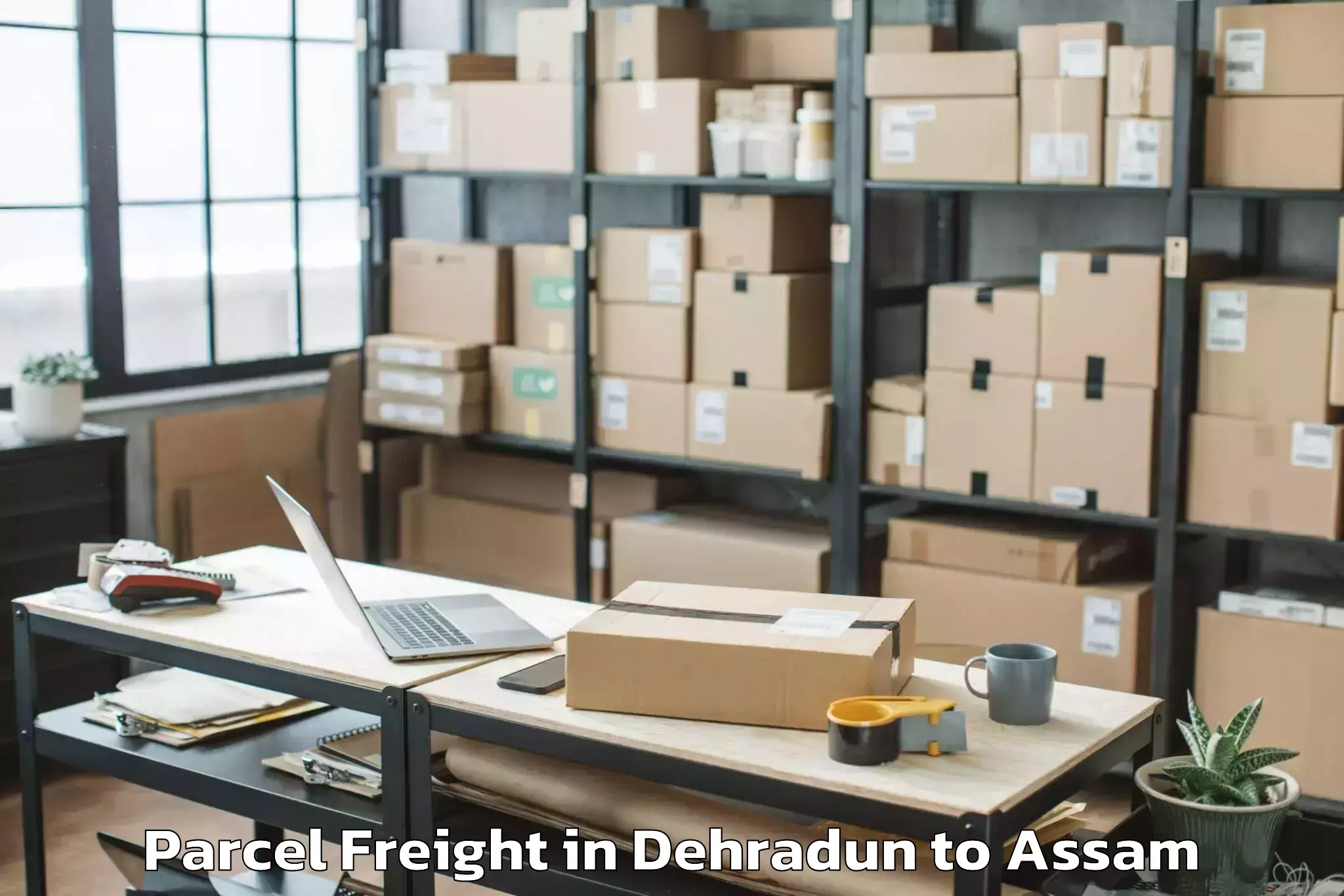 Get Dehradun to Sualkuchi Parcel Freight